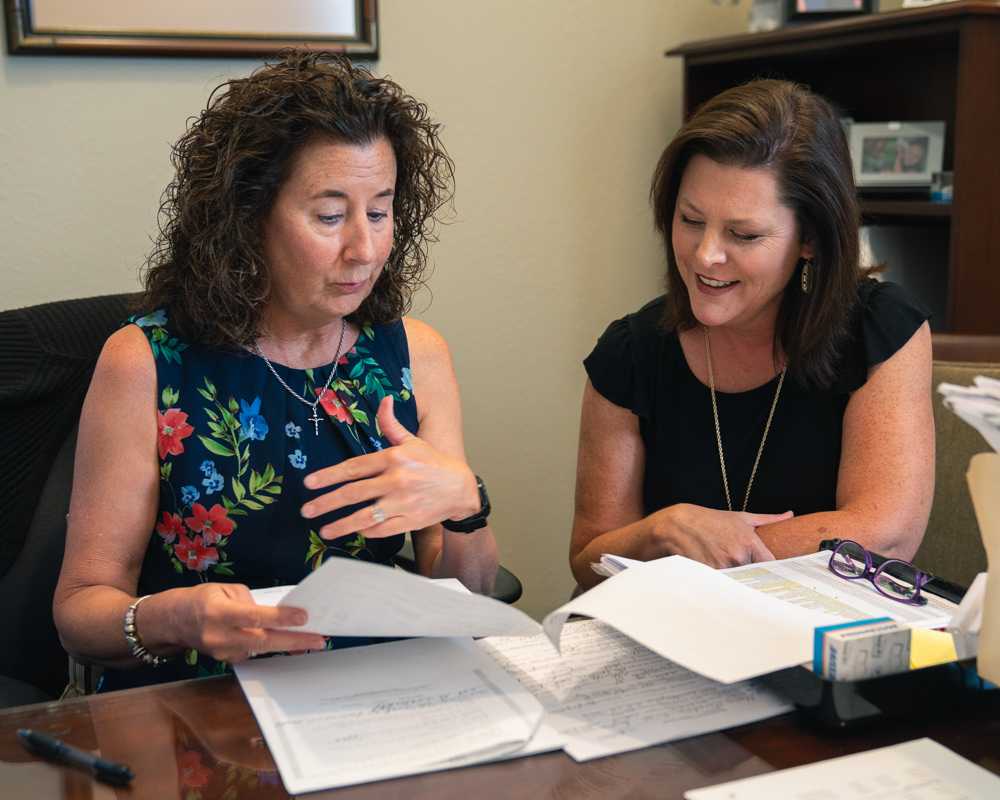 Two women discussing insurance