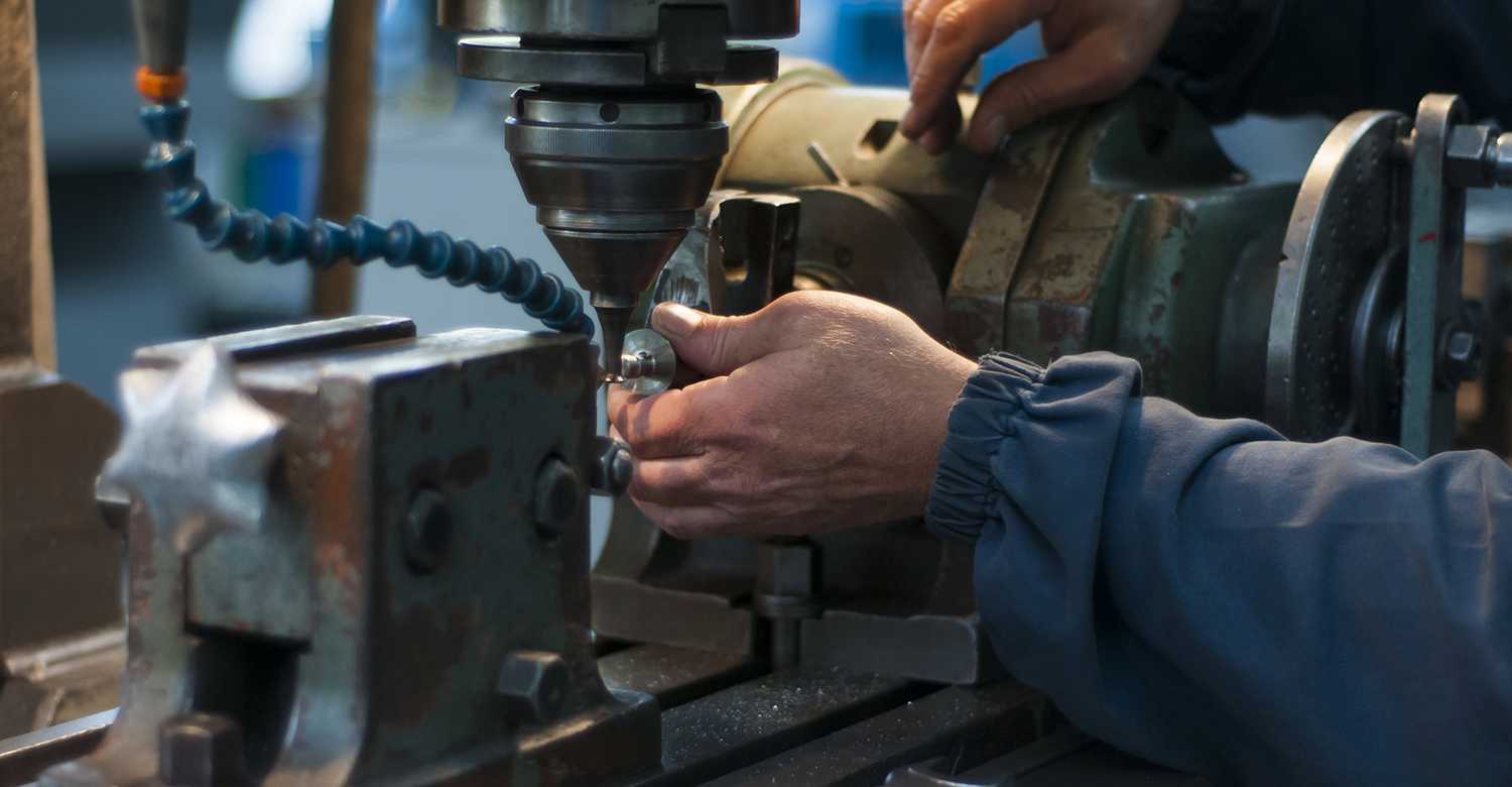 Worker using company equipment (drill)