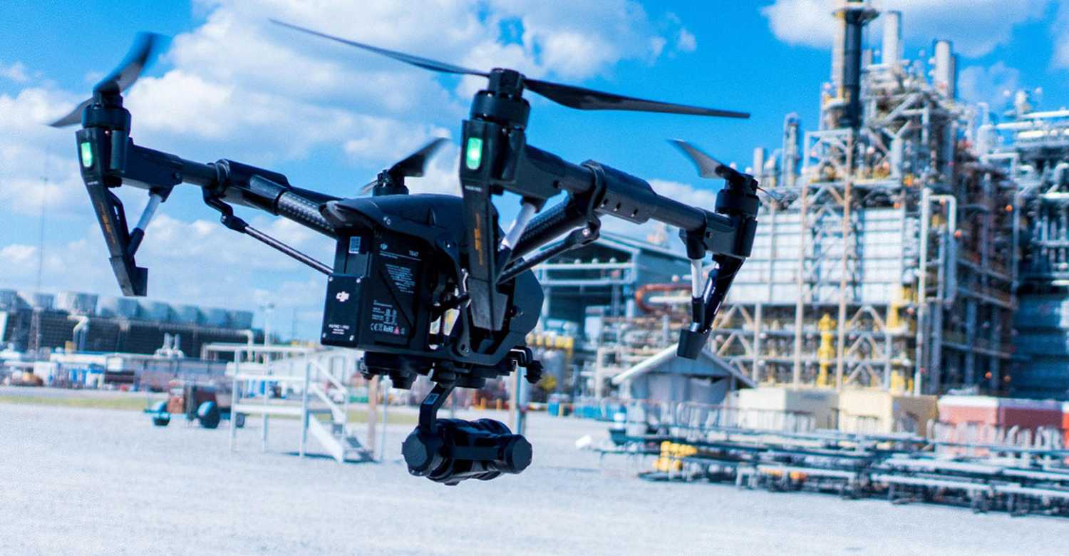 Drone flying at chemical plant.