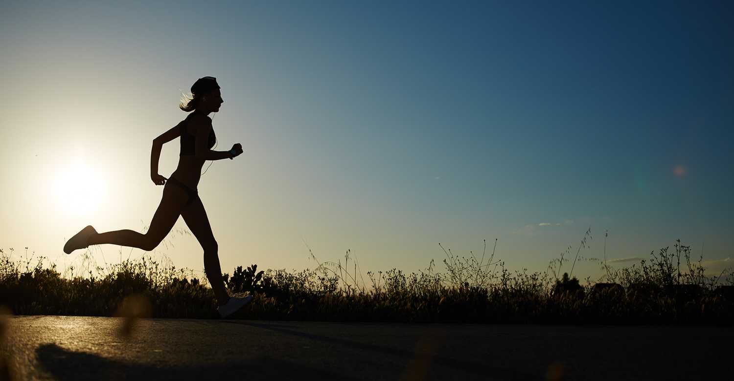 Women running on a hill